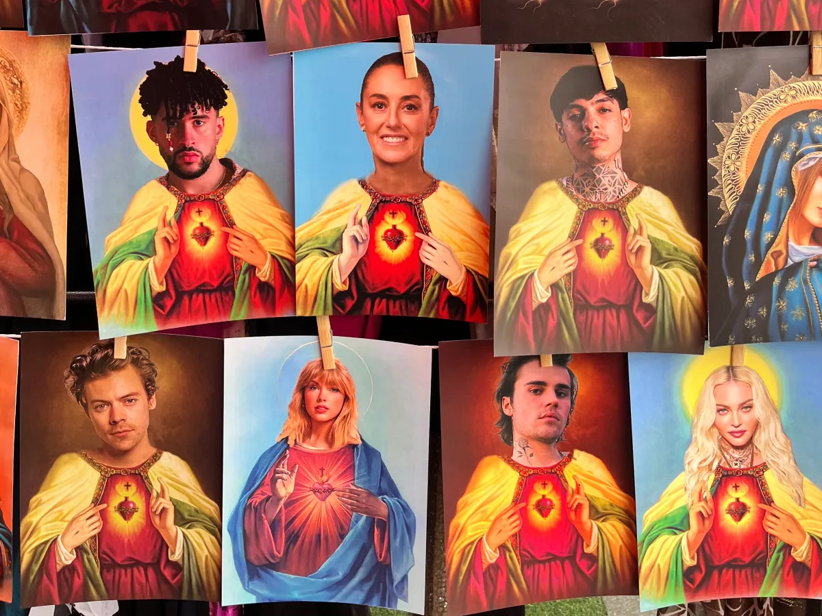 Market prints pegged on a line, putting pop-culture and political figures into Sacred Heart religious iconography